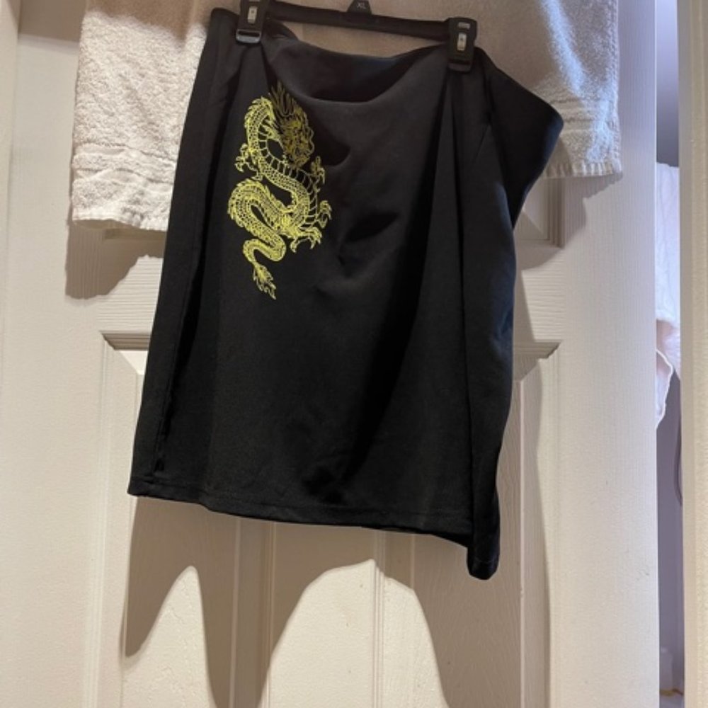 Dark black fashionable skirt with yellow dragon on front! Very versatile!
